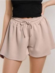 Szorty dresowe z luźnymi nogawkami soft touch - beżowy. Brązowe szorty damskie Sinsay, l, bez wzorów, z dresówki. Za 39.99 zł.