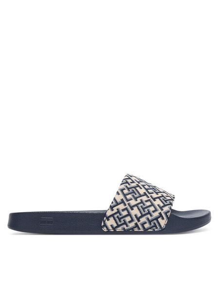 Tommy Hilfiger Klapki Monogram Pool Slide FW0FW09423 Granatowy. Niebieskie klapki damskie Tommy Hilfiger, bez wzorów, z materiału, bez obcasa. Za 169.99 zł.