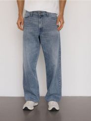 Jeansy loose z efektem sprania - granatowy. Niebieskie jeansy męskie Reserved. W wyprzedaży za 99.99 zł.