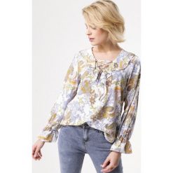 Żółta Bluzka Orb. Żółte bluzki damskie Born2be, bez wzorów, bez kołnierzyka, bez ramiączek. Za 49.99 zł.