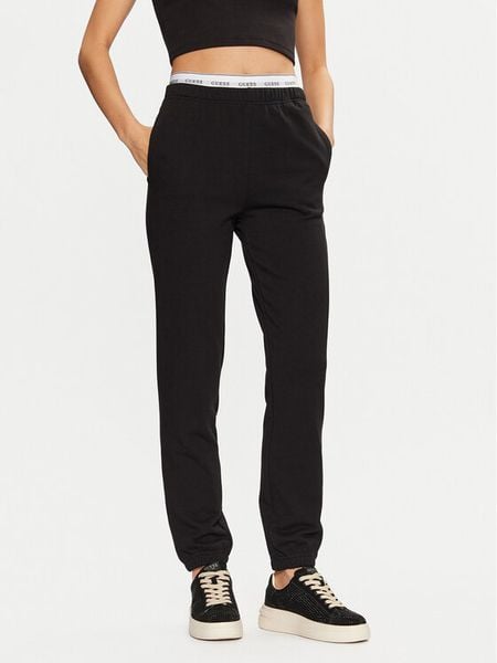 Guess Spodnie dresowe O5RB01 KCO31 Czarny Regular Fit. Czarne spodnie dresowe damskie Guess, xl, z aplikacjami, z bawełny. Za 169.99 zł.