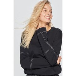 Bluza z kontrastowymi szwami - Czarny. Bluzy damskie marki KALENJI. W wyprzedaży za 29.99 zł.