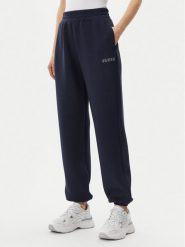 Guess Spodnie dresowe V4BB13 K7UW2 Granatowy Regular Fit. Niebieskie spodnie dresowe damskie Guess, xl, z aplikacjami, z dresówki. Za 299.99 zł.