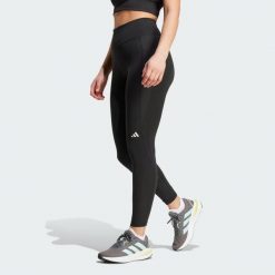 Legginsy Own the Run 7/8. Czarne legginsy damskie Adidas, l, bez wzorów, z materiału. W wyprzedaży za 209.25 zł.