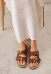 Brązowe Szydełkowe Klapki z Paskami ze Sprzączkami na Podeszwie z Imitacji Korka Elriess. Brązowe klapki damskie Renee, w ażurowe wzory, z jeansu, boho, bez obcasa, na płaskiej podeszwie. Za 79.99 zł.