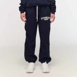 Spodnie dresowe damskie fitness oversize niebieskie Varsity. Niebieskie spodnie dresowe damskie GYMBEAM, l, bez wzorów, z bawełny, na fitness i siłownię. Za 126.90 zł.