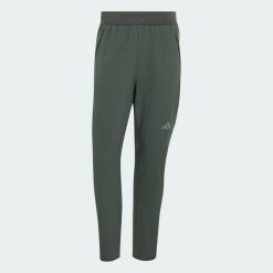 SPODNIE D4T CLIMAWARM. Zielone spodnie sportowe męskie Adidas, l, bez wzorów, z elastanu, na fitness i siłownię, climawarm (adidas). Za 439.00 zł.