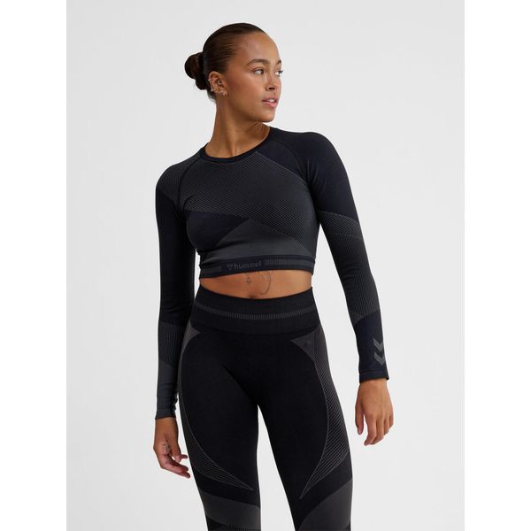 Damska bluzka treningowa bezszwowa z długim rękawem Hummel. Niebieskie bluzki damskie Hummel, bez wzorów, z materiału, sportowe, bez kołnierzyka, bez ramiączek. Za 177.00 zł.