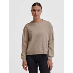 Bluza damska Hummel MT Dhyani. Zielone bluzy damskie Hummel, bez wzorów, na fitness i siłownię. W wyprzedaży za 140.00 zł.