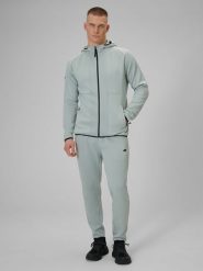 4F Spodnie treningowe szybkoschnące męskie - miętowe M. Niebieskie spodnie sportowe męskie 4f, l, bez wzorów, z materiału, na fitness i siłownię. Za 199.99 zł.