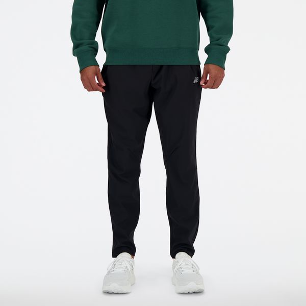 Spodnie męskie New Balance MP41060BK – czarne. Czarne spodnie sportowe męskie New Balance, m, bez wzorów, z materiału, do biegania. Za 359.99 zł.