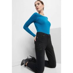 Jeansy skinny z koralikami. Czarne jeansy damskie Orsay. Za 129.99 zł.