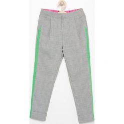 Spodnie z lampasami - Jasny szar. Spodnie materiałowe damskie marki Reserved. Za 99.99 zł.