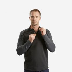 Koszulka turystyczna męska z długim rękawem Quechua SH100 Warm. Czarne koszulki sportowe męskie QUECHUA, l, bez wzorów, z elastanu, bez kołnierzyka, bez ramiączek, trekkingowe. Za 59.99 zł.
