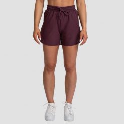 Szorty damskie fitness regular z kieszeniami bakłażanowe TRN. Czerwone szorty sportowe damskie GYMBEAM, l, bez wzorów, z elastanu, sportowe, do biegania. Za 73.90 zł.