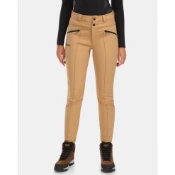 Spodnie softshell damskie Kilpi MAURA-W. Brązowe spodnie materiałowe damskie Kilpi, bez wzorów, z softshellu, narciarskie. Za 680.25 zł.