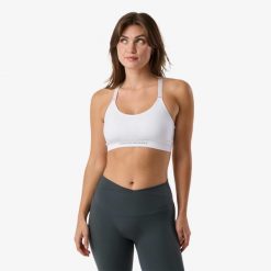 Biustonosz treningowy damski Swedemount Core Strap Bra oddychający. Białe obuwie sportowe damskie SWEDEMOUNT, bez wzorów, z tkaniny, na fitness i siłownię. Za 79.99 zł.