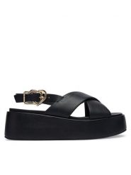 LOVE MOSCHINO Sandały JA16137I0OIA0000 Czarny. Czarne sandały damskie Love Moschino, bez wzorów, ze skóry, bez obcasa, na koturnie, bez zapięcia. Za 919.99 zł.