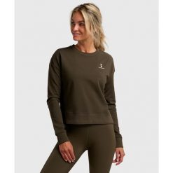 Bluza sportowa damska ekologiczna. Zielone bluzy sportowe damskie NORDICDOTS, xs, bez wzorów, z bawełny, bez kaptura, na fitness i siłownię. Za 275.00 zł.