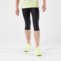 Legginsy do biegania krótkie męskie Kiprun Run 100. Czarne legginsy sportowe męskie KALENJI, l, bez wzorów, z elastanu, krótkie, do biegania. Za 54.99 zł.