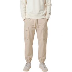 CHAMPION Spodnie męskie Woven Cargo Pants. Brązowe spodnie sportowe męskie Champion, na jesień, l, bez wzorów, z bawełny. Za 220.99 zł.