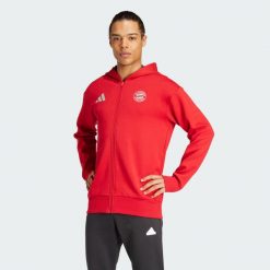 Bluza FC Bayern Anthem. Czerwone bluzy męskie Adidas, l, bez wzorów, z materiału, bez kaptura, do piłki nożnej. W wyprzedaży za 374.20 zł.