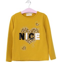 Żółta Bluzka Norwalk. Żółte bluzki dla dziewczynek Born2be, z aplikacjami, bez kołnierzyka, bez ramiączek. Za 39.99 zł.