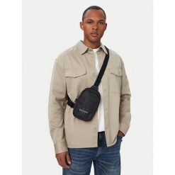 Saszetka piersiowa Calvin Klein. Czarne saszetki męskie Calvin Klein, młodzieżowe, małe. Za 249.99 zł.