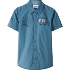 Koszula z krótkim rękawem bonprix niebieski dżins z nadrukiem. Koszule dla chłopców marki bonprix. Za 49.99 zł.