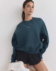 Damska bluza biegowa oddychająca, odprowadzająca wilgoć Le Run lagunowa. Zielone bluzy damskie Aim'n, s, bez wzorów, z bawełny, bez kaptura. Za 387.00 zł.