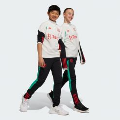 Spodnie do piłki nożnej męskie Adidas Manchester United Tiro 23 Training Pants. Czarne spodnie sportowe męskie Adidas, m, bez wzorów, z dresówki, do piłki nożnej. Za 249.35 zł.