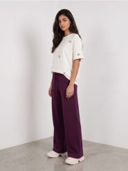 Spodnie wide leg z domieszką wiskozy - różowy. Czerwone spodnie sportowe damskie Sinsay, l, bez wzorów, z wiskozy. Za 49.99 zł.