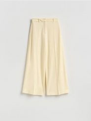 Spodnie z wiskozą - jasnożółty. Żółte spodnie materiałowe damskie Reserved, l, bez wzorów, z tkaniny. Za 129.99 zł.