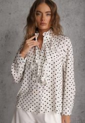 Biała Falbaniasta Koszula z Wiskozy w Kropki ze Stójką Aegista. Białe bluzki damskie Renee, m, bez wzorów, z jeansu, bez kołnierzyka, bez ramiączek. Za 129.99 zł.
