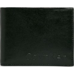 Calvin Klein - Portfel skórzany. Czarne portfele męskie Calvin Klein, bez wzorów, z materiału. W wyprzedaży za 179.90 zł.