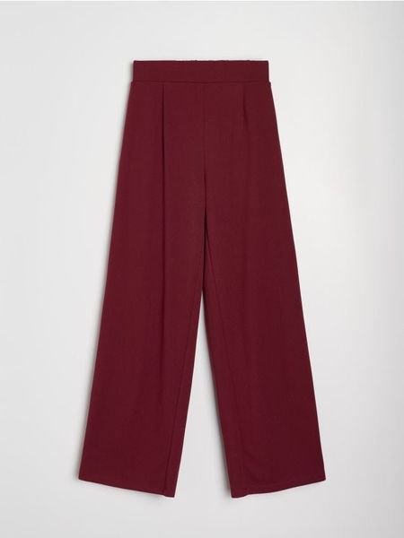 Spodnie wide leg - bordowy. Czerwone spodnie materiałowe damskie Sinsay, l, bez wzorów. Za 59.99 zł.