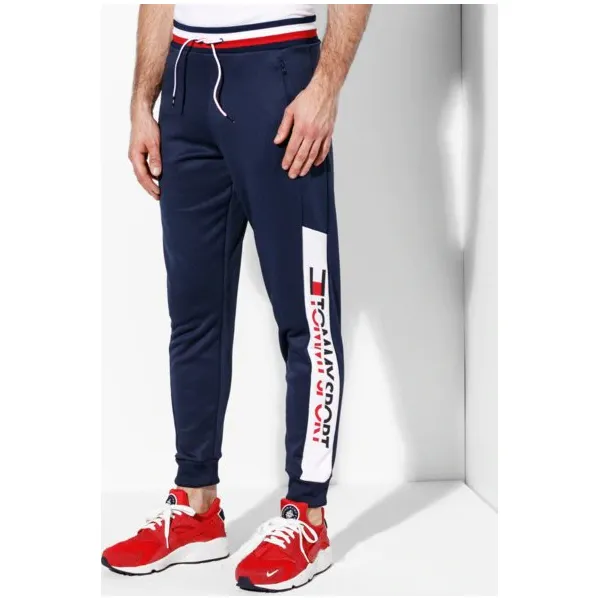 Tommy Sport Spodnie Jogger 251 , granatowy, rozmiar M. Niebieskie spodnie sportowe męskie Tommy Hilfiger, m, bez wzorów, z bawełny, na fitness i siłownię. W wyprzedaży za 319.99 zł.