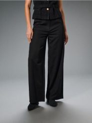 Spodnie wide leg ze szlufkami - czarny. Czarne spodnie materiałowe damskie Sinsay, l, bez wzorów. Za 59.99 zł.