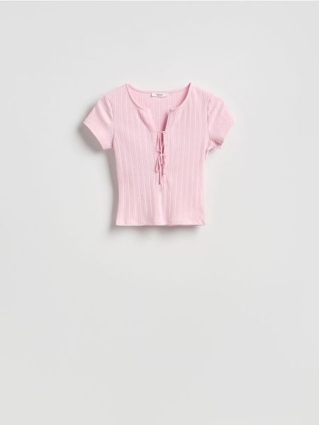 Bluzka z wiązaniem - pastelowy róż. Czerwone bluzki damskie Reserved, l, bez wzorów, z bawełny, bez kołnierzyka, bez ramiączek. Za 49.99 zł.