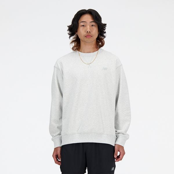 Bluza męska New Balance MT41506AHH – szara. Szare bluzy męskie New Balance, m, z aplikacjami, z bawełny, bez kaptura. Za 359.99 zł.
