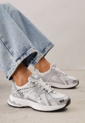 Białe Sneakersy Siateczkowe na Piankowej Podeszwie z Ozdobnymi Przeszyciami Faria. Białe obuwie sportowe damskie Born2be, bez wzorów, z dzianiny. Za 139.99 zł.