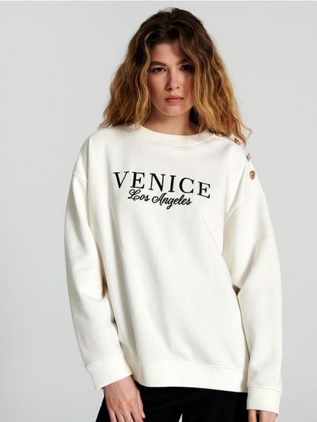 Bluza z haftem - kremowy. Białe bluzy damskie Sinsay, l, bez wzorów, z bawełny, bez kaptura. Za 59.99 zł.
