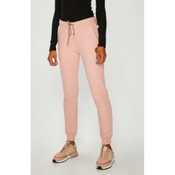 Femi Stories - Spodnie. Czerwone legginsy damskie Femi Stories, l, bez wzorów, z bawełny, climacool (adidas). W wyprzedaży za 179.90 zł.