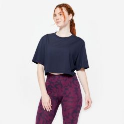 Koszulka damska Domyos Gym & Pilates crop top. Niebieskie koszulki sportowe damskie NYAMBA, xl, bez wzorów, z bawełny, bez kołnierzyka, bez ramiączek, na jogę i pilates. Za 49.99 zł.