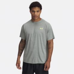 Koszulka szybkoschnąca męska Under Armour Tech Textured SS. Zielone koszulki sportowe męskie Under Armour, m, bez wzorów, bez kołnierzyka, bez ramiączek, na fitness i siłownię. Za 102.99 zł.