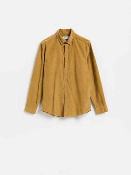 Sztruksowa koszula regular fit - bursztynowy. Pomarańczowe koszule męskie Reserved, l, bez wzorów, z bawełny, bez kołnierzyka, bez ramiączek. Za 129.99 zł.