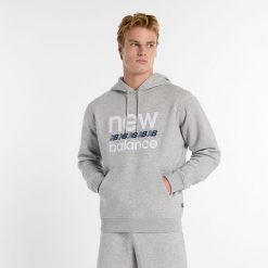 Bluza męska New Balance MT51941AG – szara. Szare bluzy męskie New Balance, m, z aplikacjami, z bawełny, z kapturem. Za 249.99 zł.