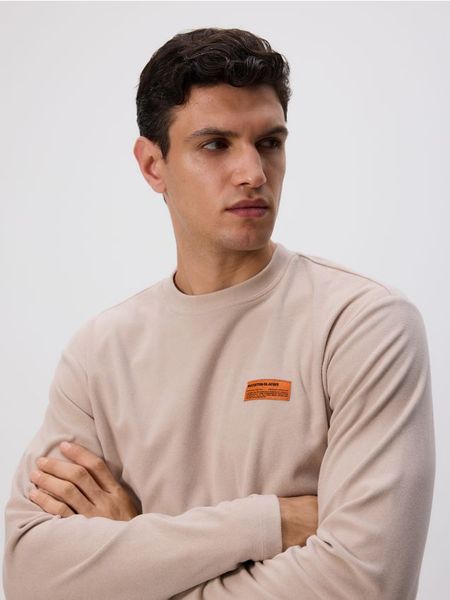 Longsleeve regular - beżowy. Brązowe bluzki z długim rękawem męskie Reserved, l, bez wzorów, z dzianiny, bez kołnierzyka. W wyprzedaży za 29.99 zł.