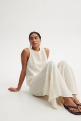 SPODNIE SUMMER ECRU S - Flawless. Spodnie materiałowe damskie Flawless, s, w ażurowe wzory, z dzianiny, z podwyższonym stanem. Za 312.20 zł.