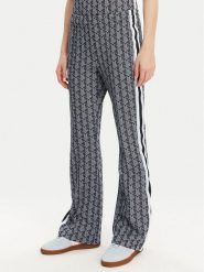 Lacoste Spodnie dresowe XF9313 Granatowy Regular Fit. Niebieskie spodnie dresowe damskie Lacoste, bez wzorów, z dresówki. Za 559.99 zł.